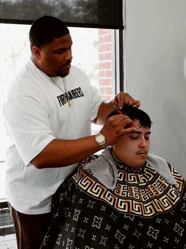 Juan, barber at Mad Barbers Avalon Park